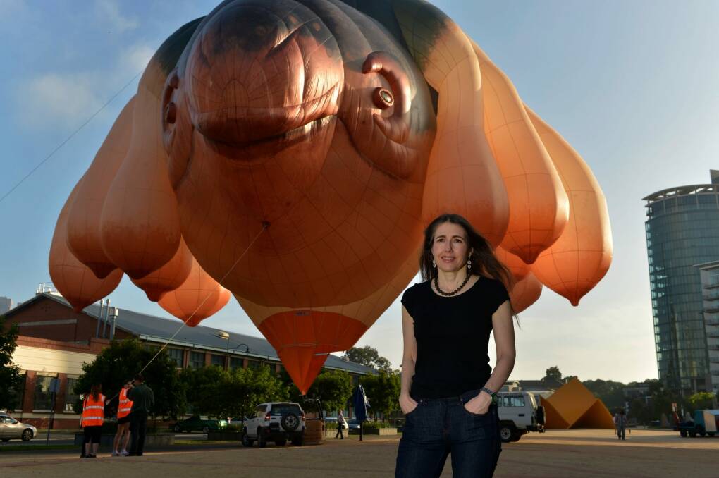 Patricia Piccinini with the Skywhale, which has hundreds of hours of flying time left.