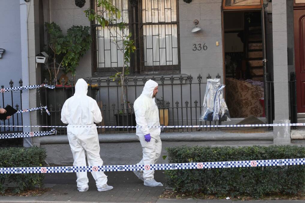 Police officers at the scene of the raid in Surry Hills, Sydney. Photo: AAP