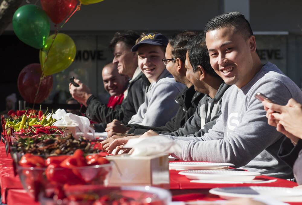 Chilli eating competitor Steven Diep at the World Curry Festival in Garema Place. Photo: Elesa Kurtz