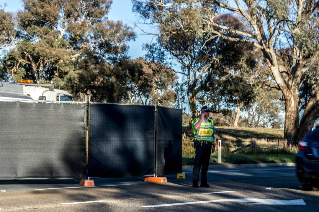 ACT policing control the scene where a truck driver died on Pialligo Avenue near Canberra Airport after a medical episode.  Photo: Karleen Minney