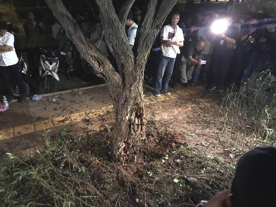 The explosion hit a tree outside the Gelora Bung Karno stadium complex in Jakarta on Sunday night, sparking fears of a bomb attack during the presidential debate. Photo: James Massola
