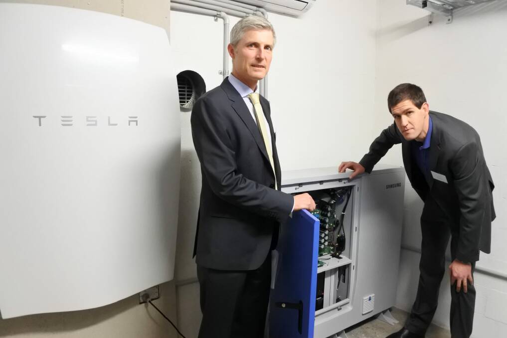 ARENA chief executive Ivor Frischknecht and ITP Renewables' managing director Simon Franklin with the Samsung All In One 10.8kWh battery and the Tesla Powerwall battery, which will both be tested at the CIT's new Lithium-ion Battery Test Centre Photo: Clare Sibthorpe