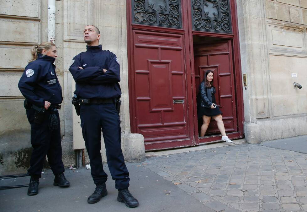 French police officers outside the residence of Kardashian West in Paris following the robbery. Photo: AP