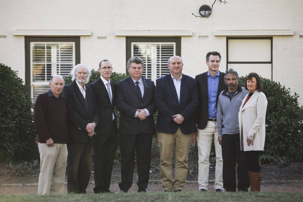 Canberra doctors are demanding public hearings in an upcoming inquiry into the ACT's health system.
From left, Dr Alan Schroot, Dr Peter Hughes, Dr Richard Singer, Executive officer of ASMOF ACT Stephen Crook, Dr Antonio Di Dio, Dr Stuart Berry, Dr John Tharion, and Dr Suzanne Davey. Photo: Jamila Toderas