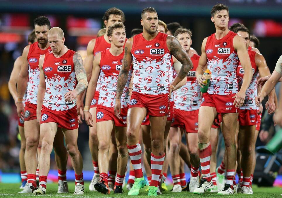 Wings clipped: Lance Franklin and the Swans come to terms with defeat on Friday night. Photo: Getty Images