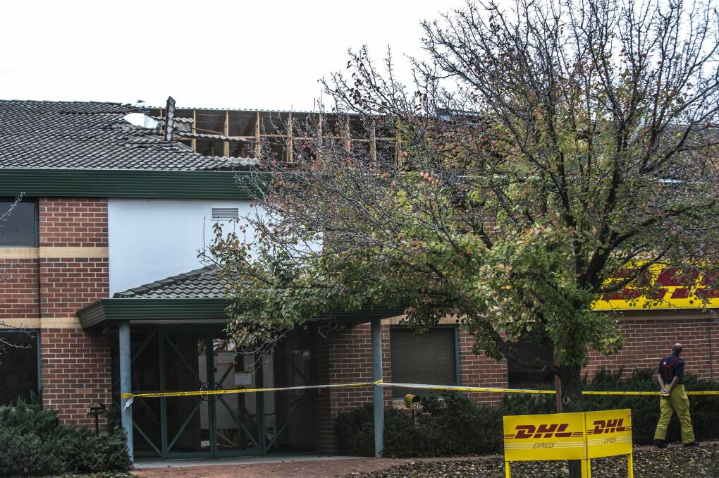 Emergency services assess the DHL roof collapse on Canberra Avenue in Fyshwick. Photo: Karleen Minney