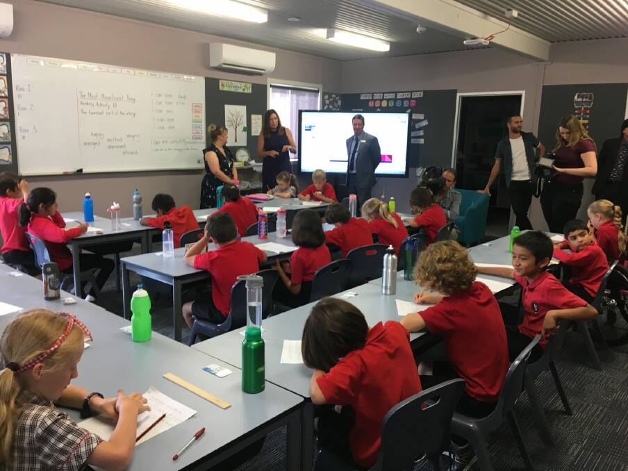 Education Minister Yvette Berry drops in on a year 3 class learning in Aranda Primary's new transportable building. Photo: Emily Baker