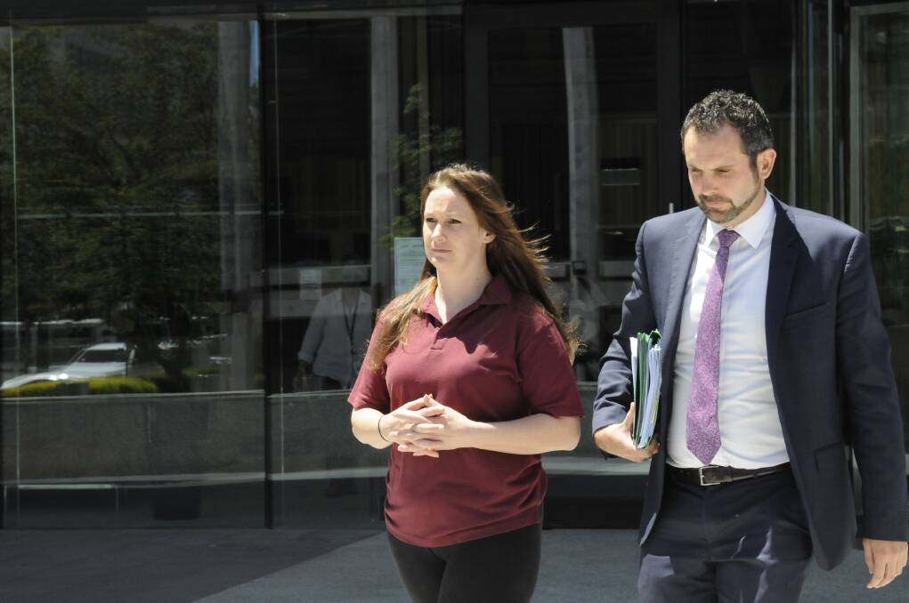 Tessa Woodcock, who kidnapped her son Phoenix Mapham in August causing a week-long search, leaves the ACT Magistrates Court with her lawyer Adrian McKenna after receiving bail. Photo: Elliot Williams