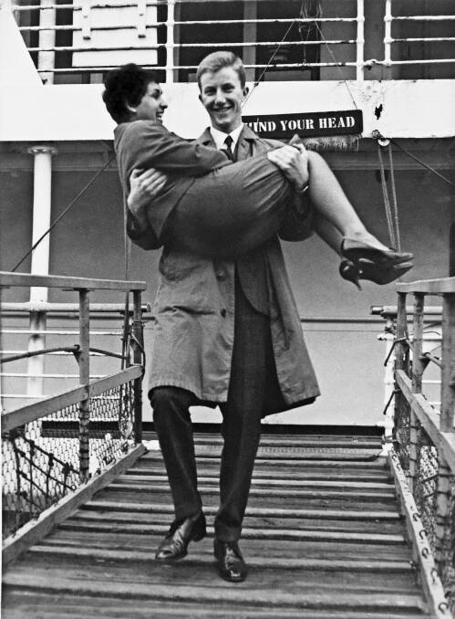 Brian Jonmundsson carries his wife Visitacion off the Strathmore liner in Sydney in 1963. Photo: Supplied