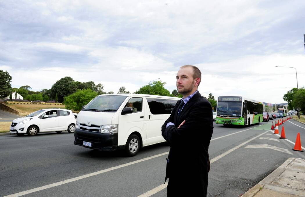 Sam Spencer of Belconnen looks on at the heavy traffic on Commonwealth Avenue. Photo: Melissa Adams