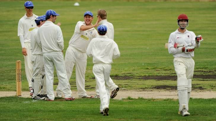 Queanbeyan players celebrate the wicket of Wests' Darren Richards at Freebody Oval. Photo: Colleen Petch