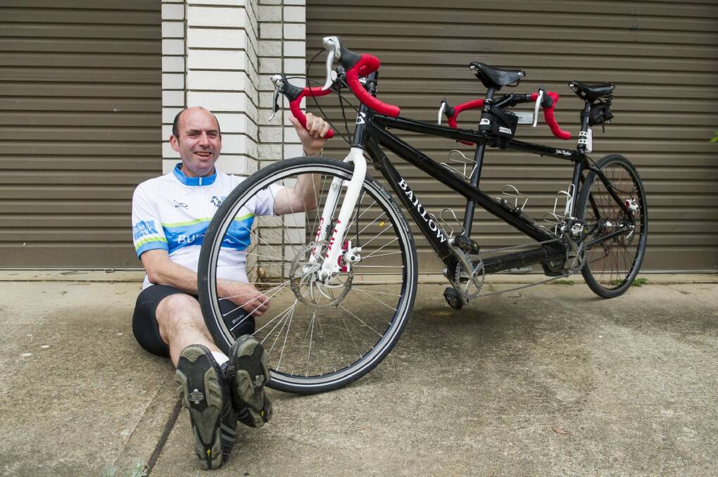 In shape: Vision-impaired tandem cyclist John Barlow will be riding 210 kilometres for charity in Melbourne later this month.  Photo: Jay Cronan