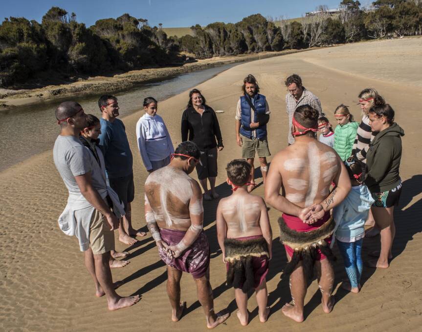 Our tour group forms a circle before the Whale Dreaming Ceremony at Nangudga Inlet. Photo: Jim Klapsogiannis