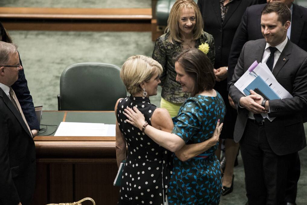 Liberal MP Kelly O'Dwyer is congratulated by Julie Bishop after Wednesday's valedictory speech. Photo: Dominic Lorrimer