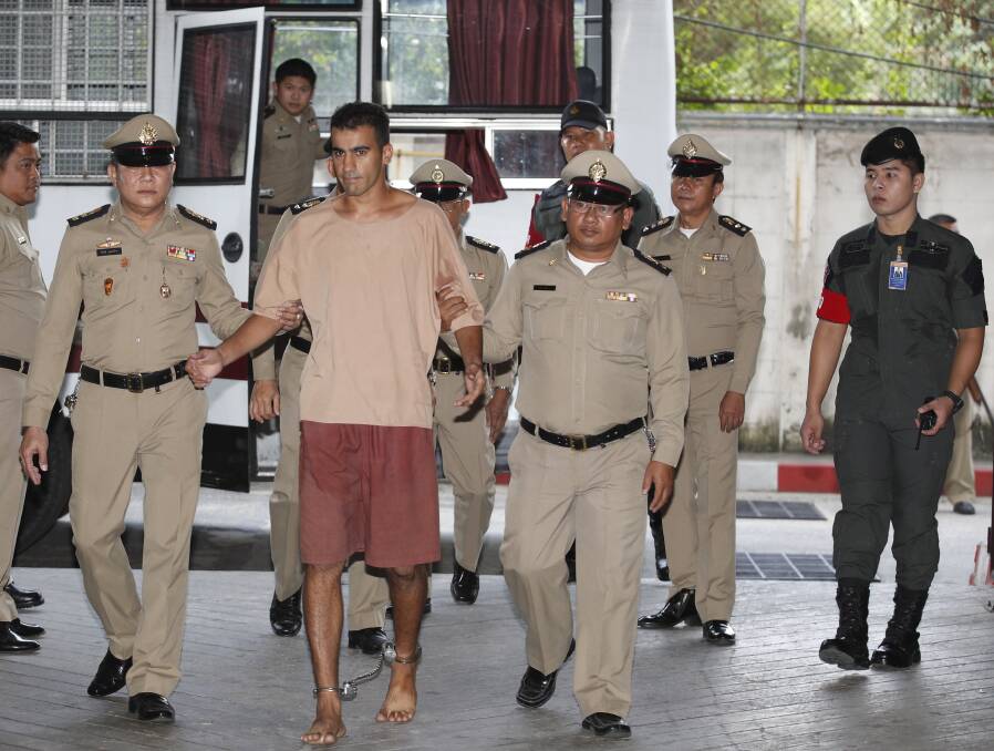 Hakeem Al-Araibi arrives at the Bangkok court on Monday with his legs shackled. Photo: EPA