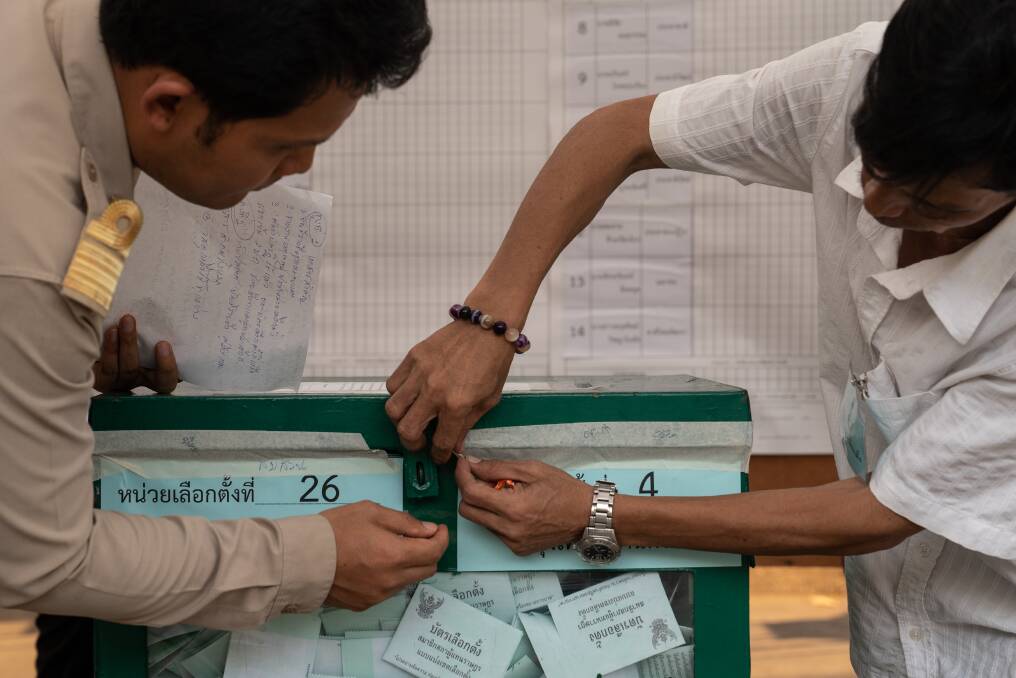 Officials open a sealed ballot box ahead of counting for a general election at a counting centre in Bangkok on Sunday. It was Thailand's first general election since the military seized power five years ago. Photo: Bloomberg