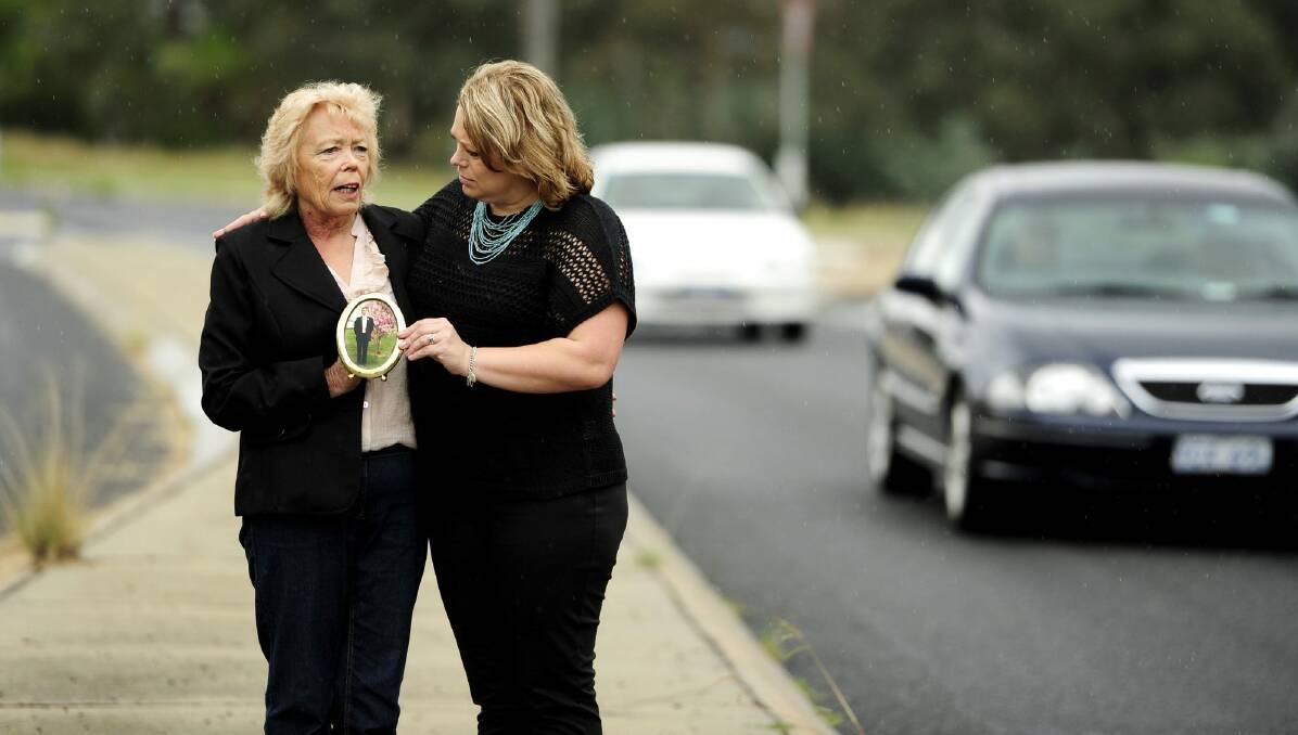 Troy's mother Valerie Tomkins, left, who died earlier this year, and sister Vanessa, right, at the scene of the hit-run. Photo: Stuart Walmsley