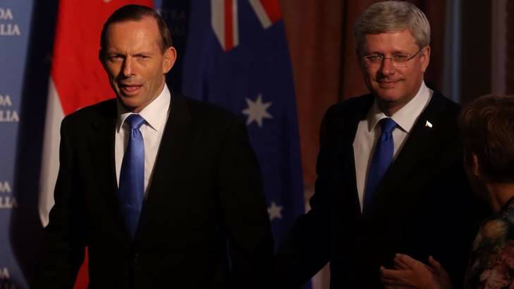 Prime Minister Tony Abbott and Canadian Prime Minister Stephen are increasingly isolated in their push to limit action to mitigate climate change. Photo: Andrew Meares