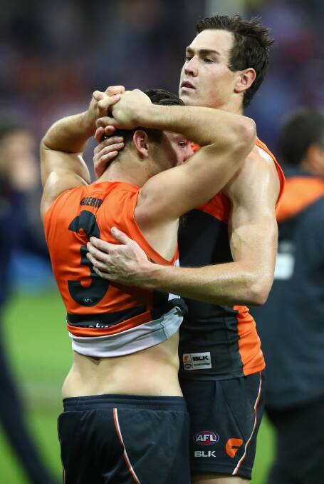 Heartbroken: Jeremy Cameron consoles Stephen Coniglio after the Giants' preliminary final loss. Photo: Getty Images