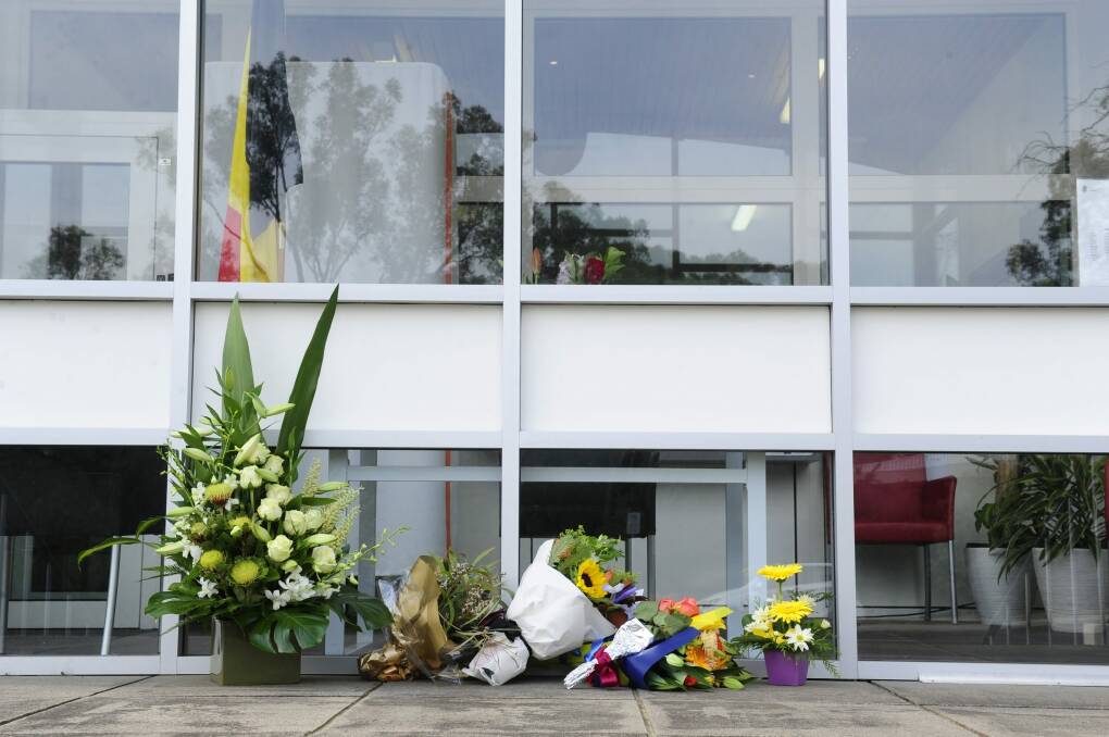 Floral tributes outside the embassy, where visitors can sign a condolence book.  Photo: Melissa Adams