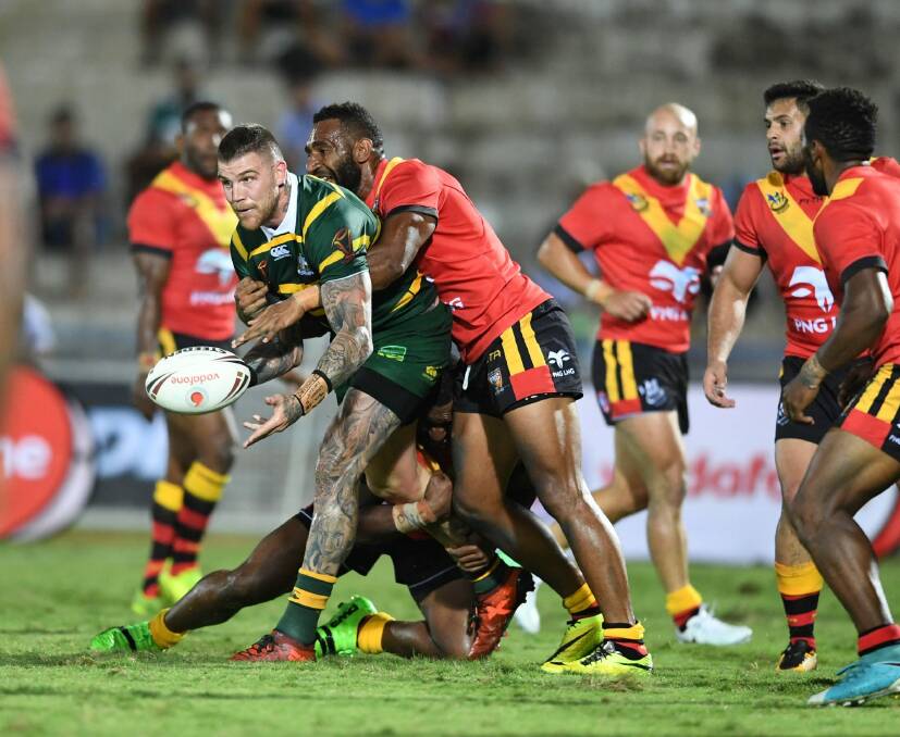 Offload: Josh Dugan gets the ball away against the Kumuls. Photo: NRL Photos