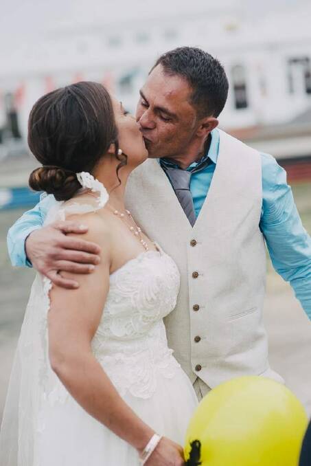Kristie and John Simpson seal it with a kiss on their historic wedding day. Photo: Alex Pasquali Photographs