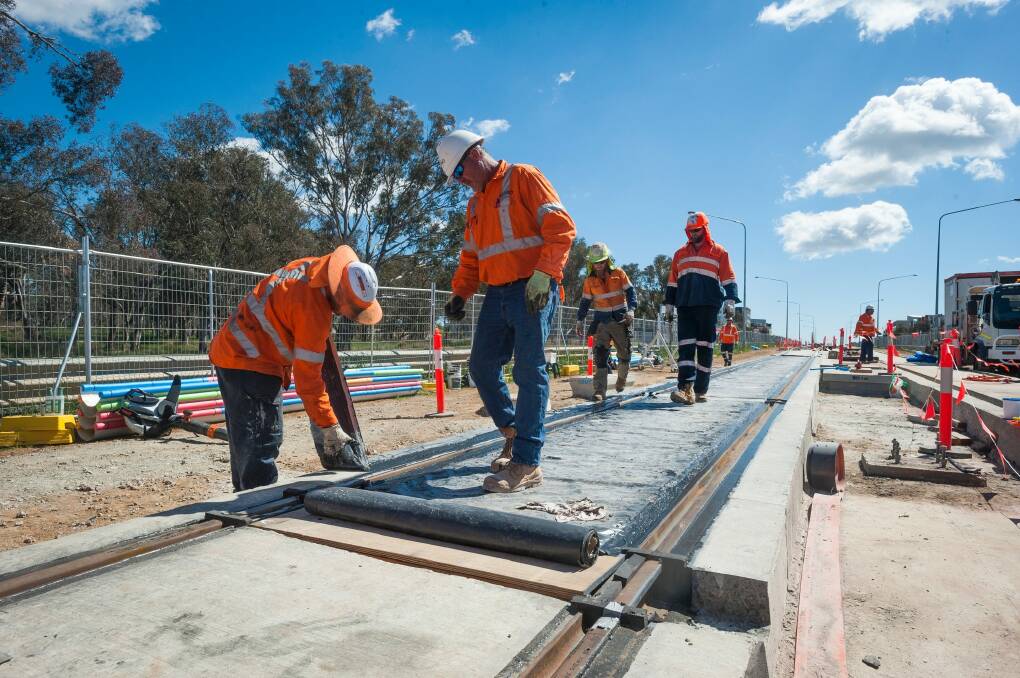 The first tracks in Canberra's light rail project have been laid in Franklin.  Photo: Dion Georgopoulos