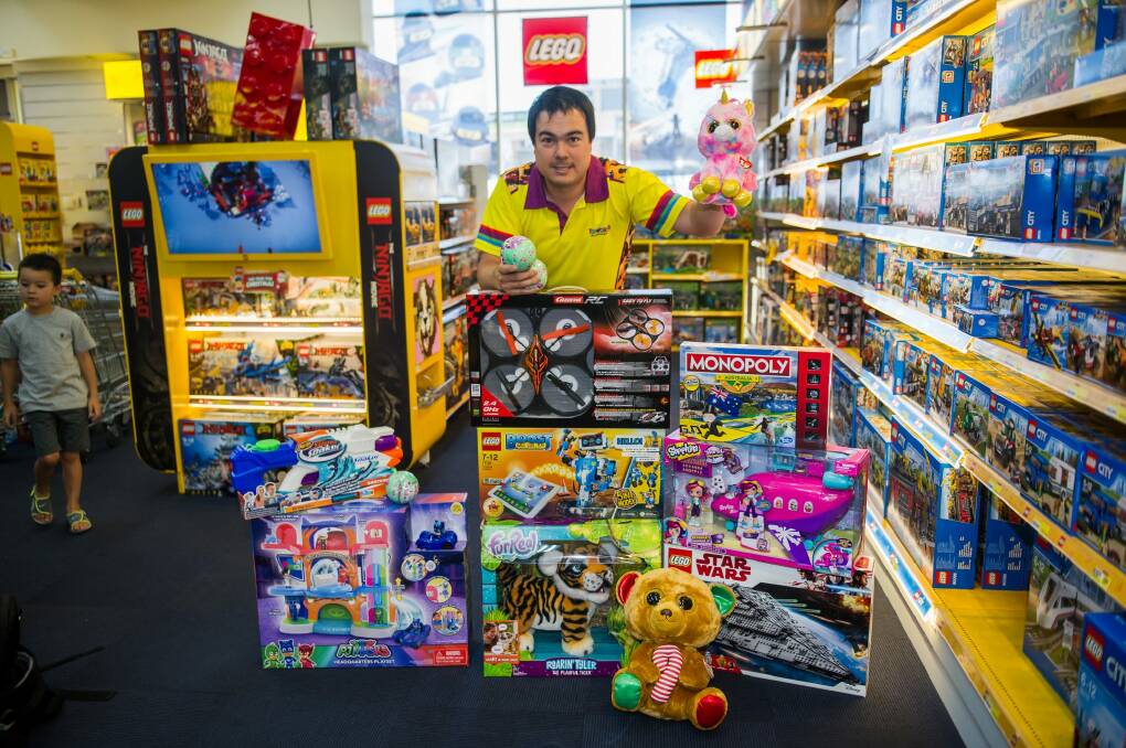 Toyworld Fyshwick managing director Geoff Morton with some of the hottest toys on Santa's list for Christmas 2017. Photo: karleen minney