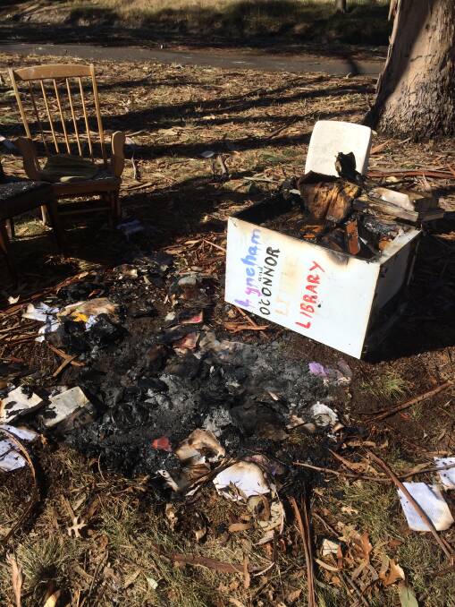 The remains of the Lyneham and O'Connor Little Library after vandals set fire to it. Photo: Tim Hollo