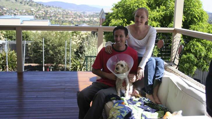 Jaid and Jenny Dawson of Banks with their dog Miley recovering after being burnt at a dog salon. Photo: Supplied