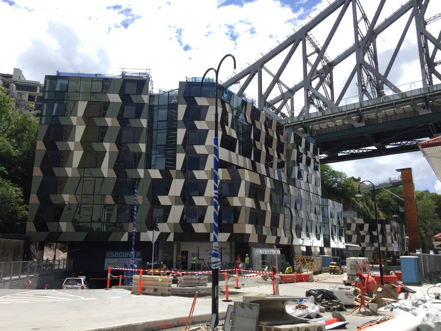 New five-star hotel looks like a deck of playing cards under the Story Bridge. It opens in March 2019. Photo: Tony Moore