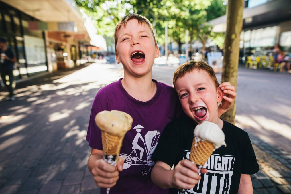 Brothers Owen, 7, and Louis, 5, Birchenough enjoying ice creams in heat in the city on Thursday afternoon. Photo: Rohan Thomson