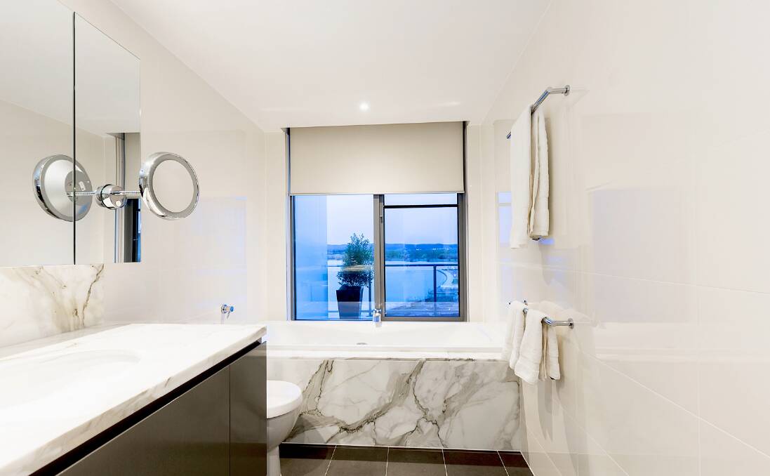 The home features marble bathrooms. Photo: AllHomes