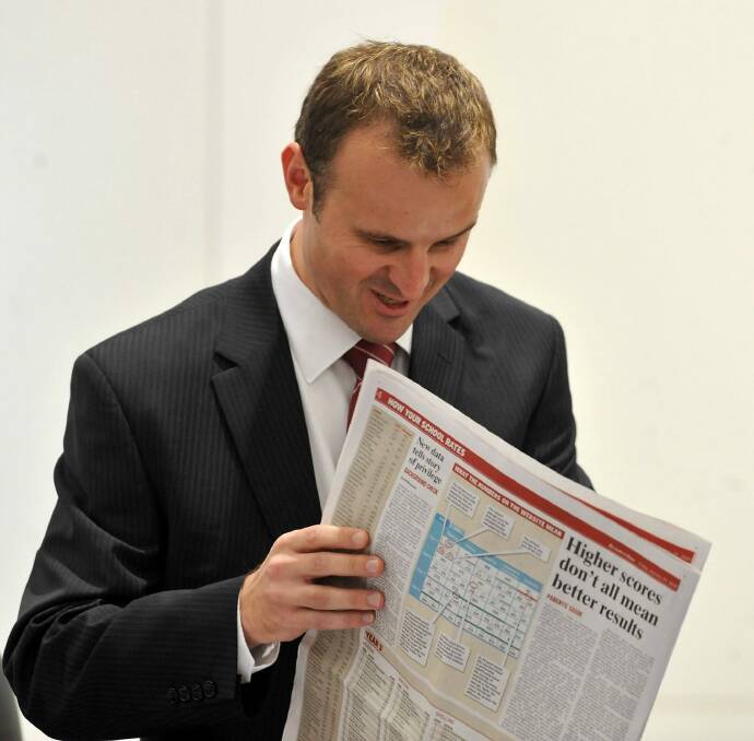 In this file photo from 2010, then- education minister Andrew Barr refers to The Canberra Times education coverage in praising the performance of Canberra Schools. Photo: Gary Schafer GCS