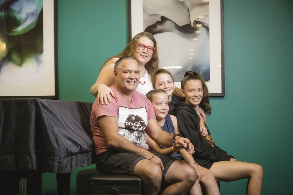 James and Fiona with three of their nine kids - Matilda, Eddie and Olivia. Photo: Sitthixay Ditthavong