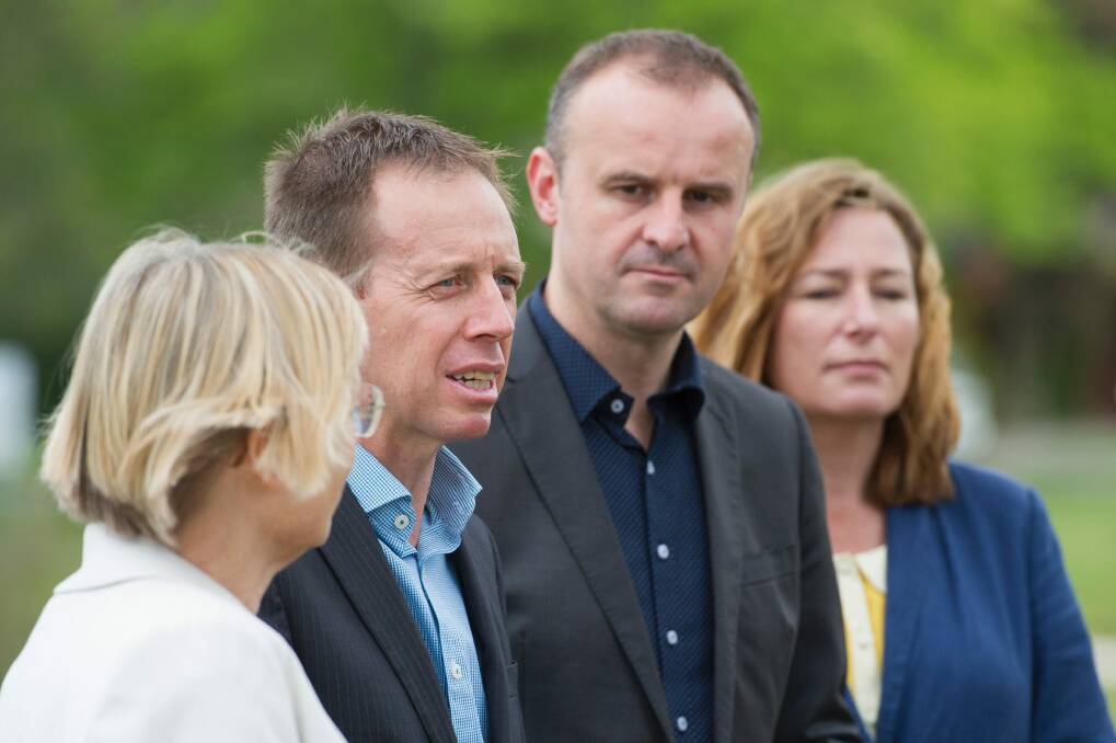 The Greens' Caroline Le Couteur and Shane Rattenbury, with ACT Chief Minister Andrew Barr and deputy Yvette Berry announcing the parliamentary deal at the Lyneham wetlands on Sunday. Photo: Jay Cronan