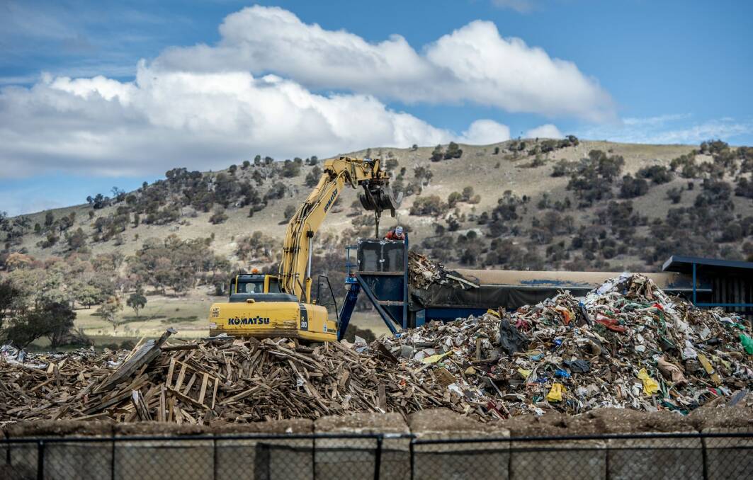 An excavator at work at the Hume site on Tuesday.  Photo: Karleen Minney