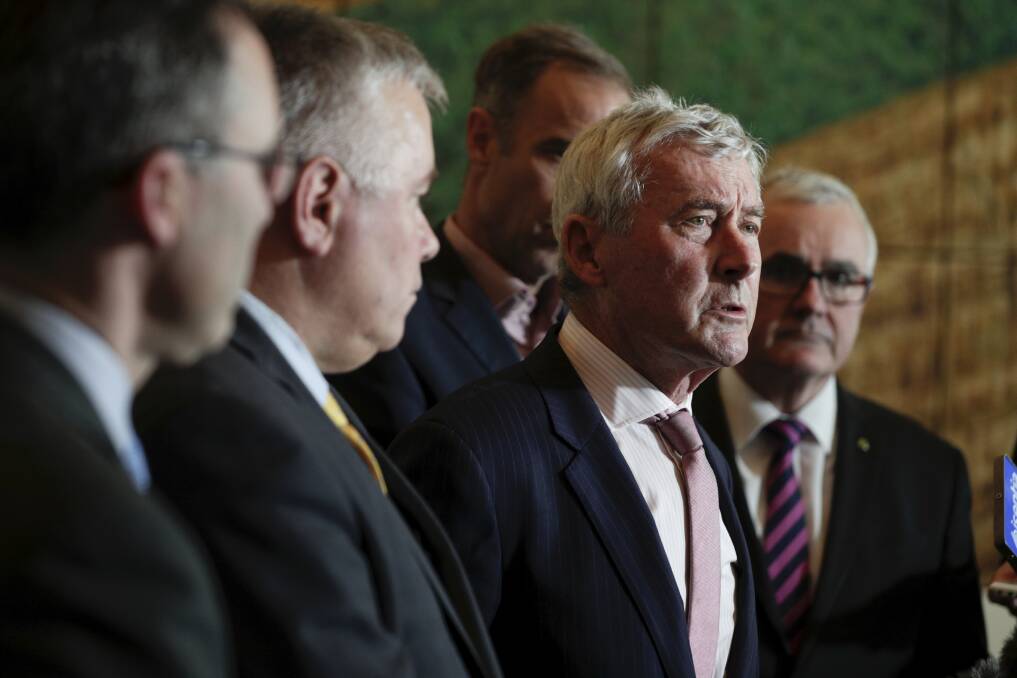 Bernard Collaery, flanked by Senators Tim Storer, Rex Patrick, Nick McKim and Andrew Wilkie, addresses the media during a press conference on the East Timor spy scandal, at Parliament House in Canberra on  Thursday 28 June 2018. Photo: Alex Ellinghausen
