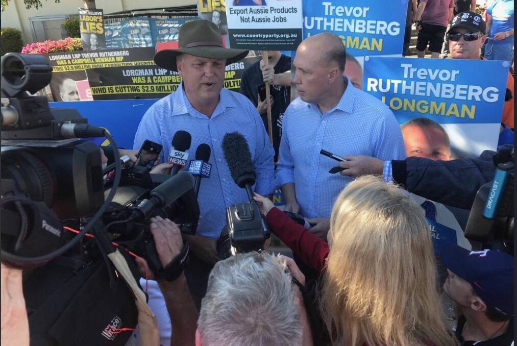Federal Immigration minister Peter Dutton (Dickson) campaigns with Trevor Ruthenberg in his neighbouring seat of Longman during the Super Saturday election. Photo: Supplied