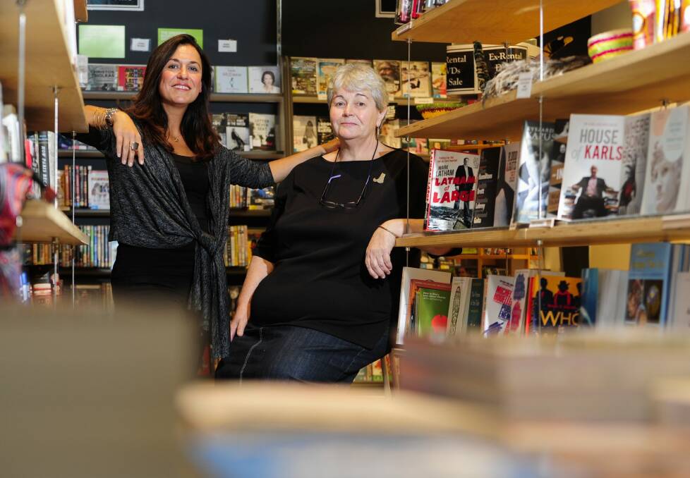 Katarina Pearson, left, and Anne Hutton of the Electric Shadows Bookshop, in Braddon, which is closing down. Photo: Melissa Adams