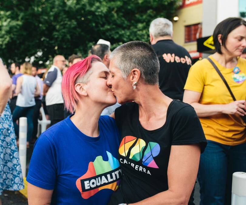 Siobhan Leyne and Anna Dacre celebrate their love and the survey result at the 2017 Braddon street party. Photo: Rohan Thomson