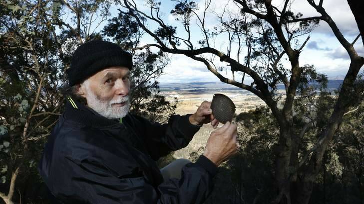Dave Wheeler from Gordon with the engine plate of a De Havilland Gipsy DH Six Series 2 that his uncle Bill Guard III in his early teens salvaged from a plane crash during WWII on Mt Ainslie. Photo: Jeffrey Chan
