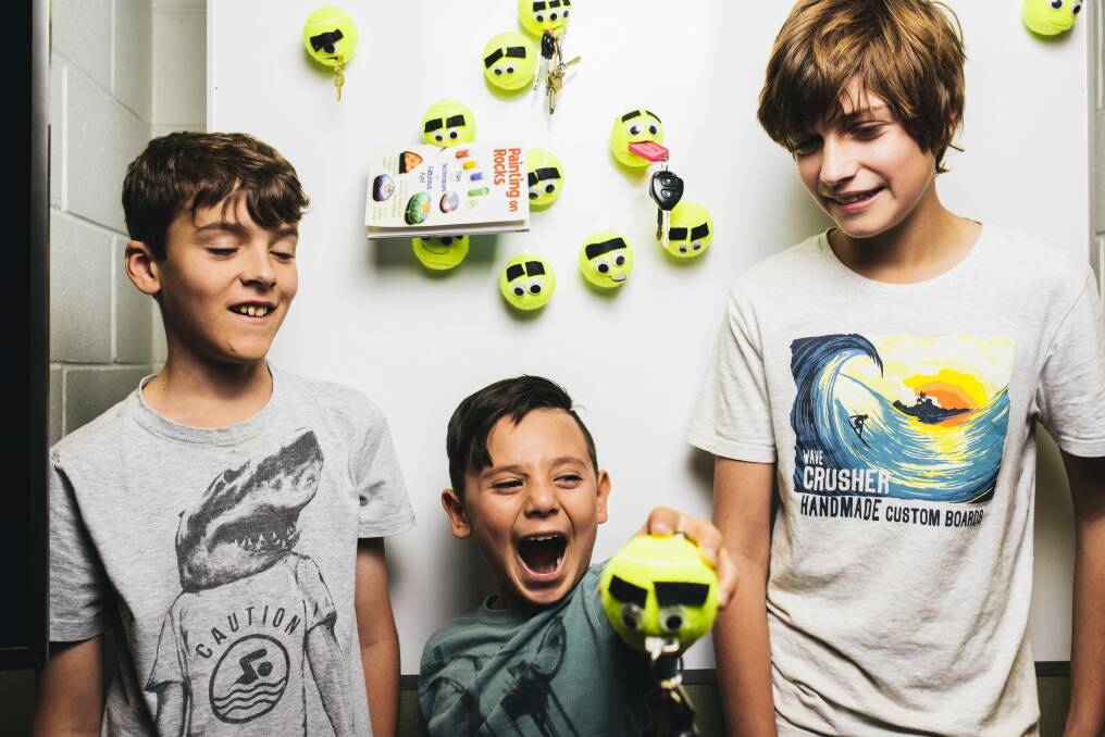 Kidpreneurs Sam Mckinney (11), Charlie Habda (8) and Ethan Allen (12) with their tennis ball key holders. 
 Photo: Rohan Thomson