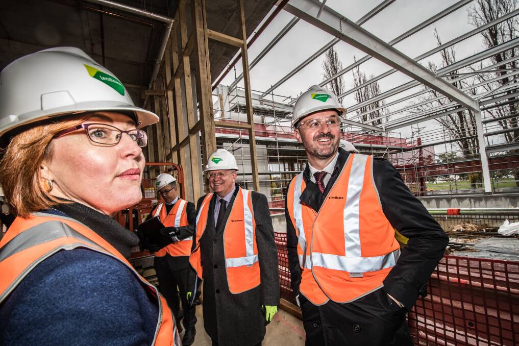 ACT Minister for Higher Education Meegan Fitzharris, vice-chancellor Brian Schmidt (second from left), and Chief Minister Andrew Barr took a tour of the work in progress on Tuesday. Photo: Karleen Minney