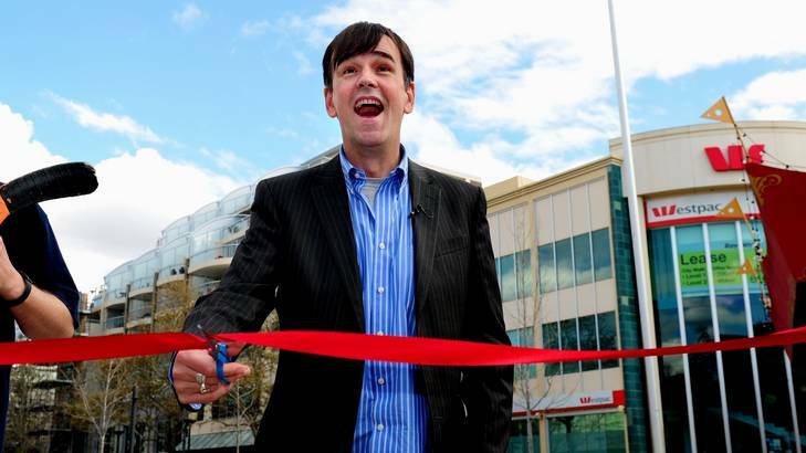 Tim Ferguson in Petrie Plaza yesterday after cutting the ribbon at the plaque honouring the Doug Anthony All Stars. Photo: Melissa Adams 