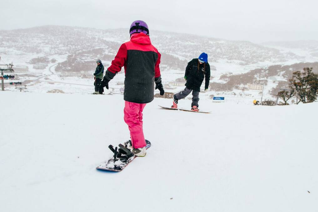 Some snowboarders at play during the snowfall at Perisher on Saturday. Photo: Supplied