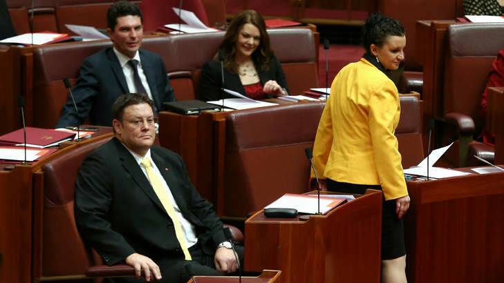 PUP Senator Jacqui Lambie takes her seat along with colleague Glenn Lazarus, right, and, behind, Greens senators Scott Ludlam and Sarah Hanson-Young. Senator Lambie has had her first meeting with Prime Minister Tony Abbott. Photo: Alex Ellinghausen