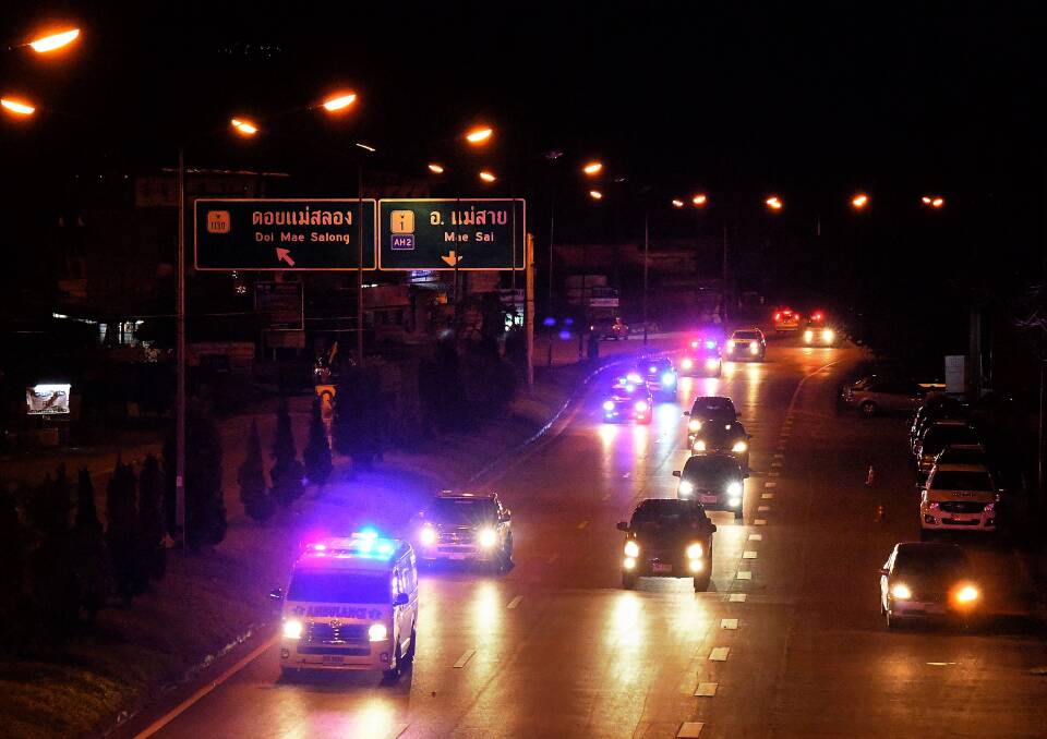 Ambulances escorted on the road from Mae Sai to Chiang Rai on Sunday night. Photo: Kate Geraghty 