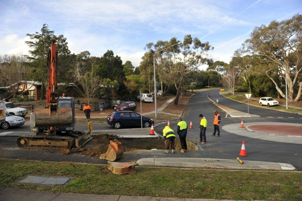 A section of road has collapsed at the intersection on Langdon Avenue and Longmore Cresent in Wanniassa  Photo: Jay Cronan