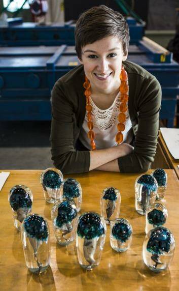 Canberra Glassworks artist-in-residence Emilie Patteson with the piece <em>Mushrooms</em>, created with Annika Romeyn. Photo: Jamila Toderas